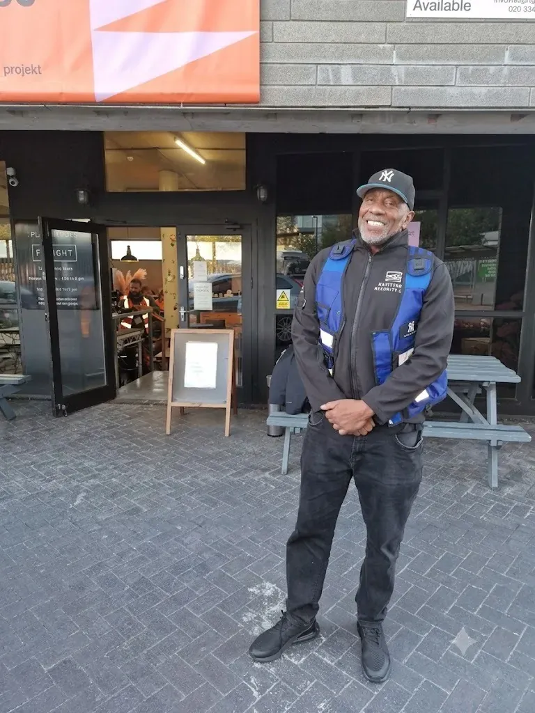 Zentinel door supervisor at a cafe bar entrance during the day